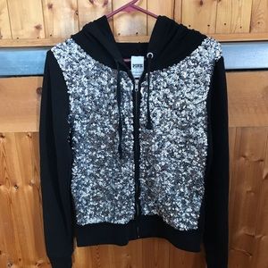 Long sleeved, zip front, lightweight hoodie.